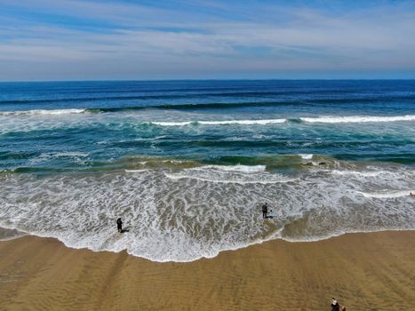 Aerial view of Huntington Beach and coastline during hot blue sunny summer day, Southeast of Los Angeles. California. destination for holiday and surfer