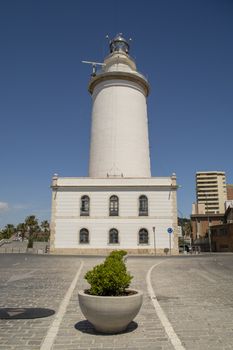 Malaga, Spain, April 2016: La Farola lighthouse: One of the oldest and most historic lighthouses of Spain, this tower has lived an eventful life.