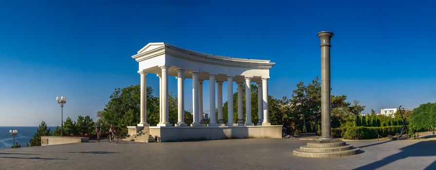 Chernomorsk, Ukraine 08.22.2020. Colonnade and Obelisk of Glory in Chernomorsk city on a sunny summer morning