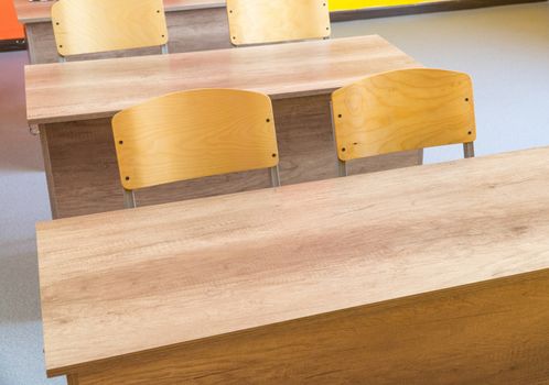 Empty school classroom with chairs, desks. Interior of a school classroom