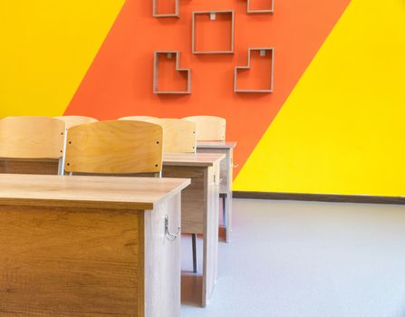 Empty school classroom with chairs, desks. Interior of a school classroom