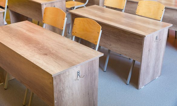 Empty school classroom with chairs, desks. Interior of a school classroom