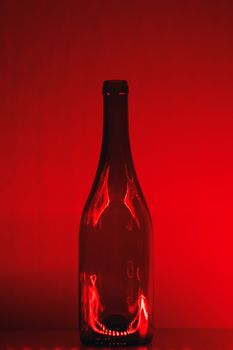 abstract empty wine bottle with red led illumination