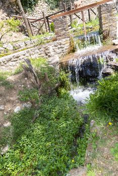 Piccolo makes water and forms a small waterfall on a sunny day