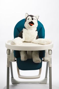 dog toy on high chair for baby