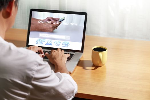 Business and job concept. Man use laptop computer online website find new career. Man searching vacancies or position on the internet. Man unemployed search finding jobs from internet. with copy space.