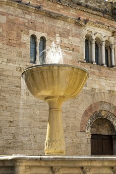 bevagna,italy august 13 2020:Fountain located in front of the church of San Silvestro in the town of Bevagna