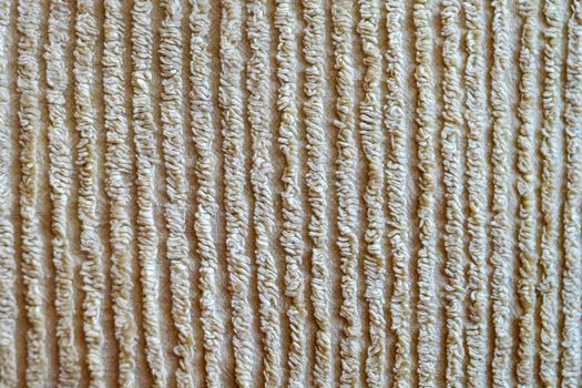 texture of beige ribbed material for background close-up