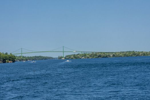 a transport bridge made of metal structures, thrown across the river, allows heavy, trucks