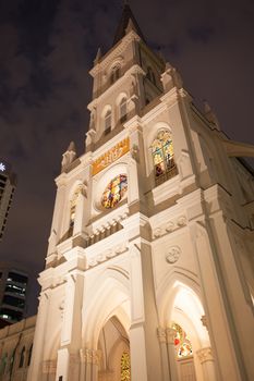Singapore CBD, Singapore - April 12th 2014: Illuminated St Andrew's Cathedral on a warm Singaporean night