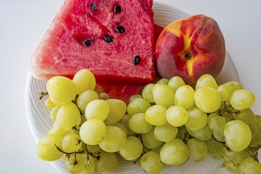 peaches, watermelons, and grape fruits on plate