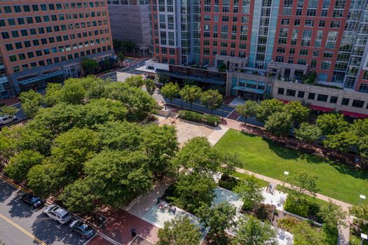 Reston, VA, USA -- August 26, 2020. A wide angle aerial photo of Reston Town Center Park in summer.