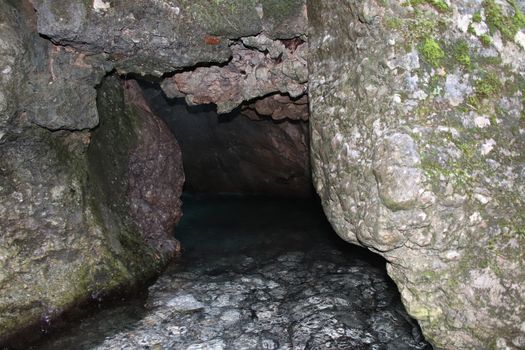 natural view with underground river between the rocks