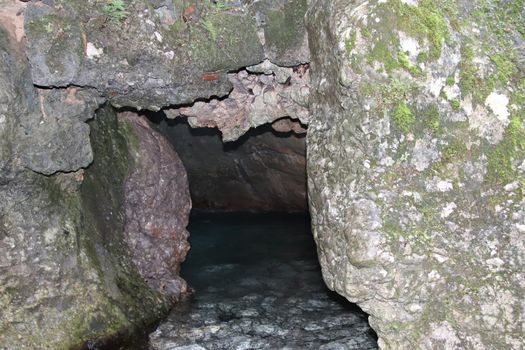 natural view with underground river between the rocks