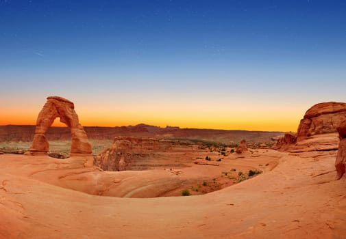 Panoramic view of the Delicate Arch at dawn in Arches National Park, Utah, USA.