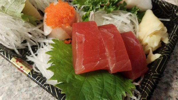 red tuna sushi seafood and other fish in container