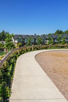 Convenient concrete walkway along the row of new townhouses