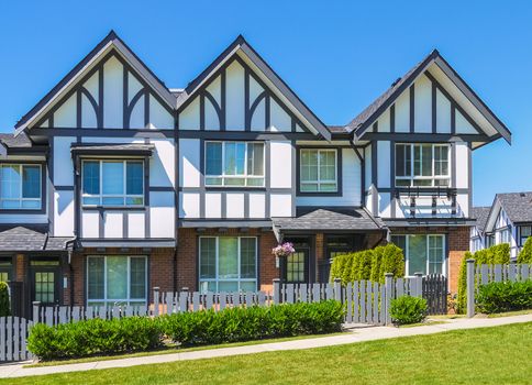 Row of new townhouses on bright sunny day