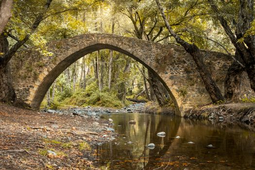 Kelefos Cyprus medieval and Venetian bridge (Tzielefos bridge) between Agios Nikolaos and Platres villages, Troodos mountains during early autumn