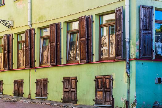 Colorful Cobblestone Street in Vilnius Old Town. Tattoo Shop Window View