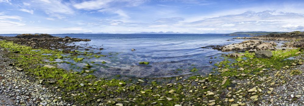 Panoramic view from Ronachan Beach, Kintyre off the West coast of Scotland looking towards Isle of Gigha