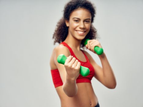 Sportive woman with dumbbells in hands workout exercises gymnastics lifestyle health