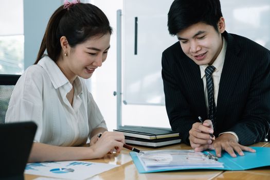 Young Asian Business people having a business meeting with executive.