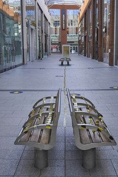 High Wycombe,England-June14,2020:2Taped up seats in shopping mall in readiness for re-opening of shops after Covid19 pandemic