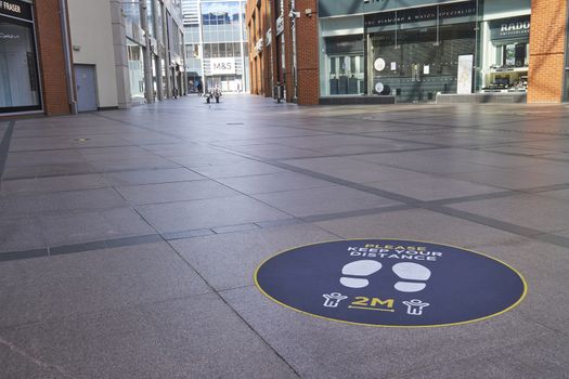 High Wycombe,England-June14,2020:2Metre social distance signs on floor in shopping mall in readiness for re-opening of shops after Covid19 pandemic