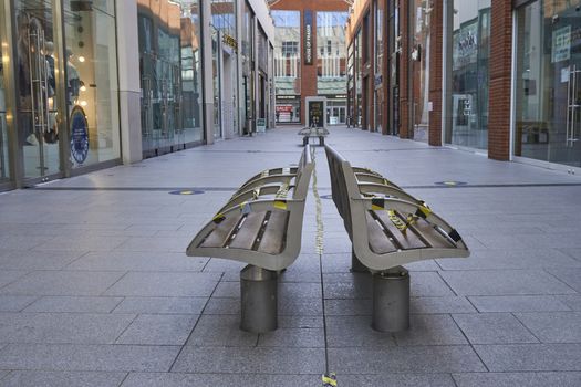 High Wycombe,England-June14,2020:2Taped up seats in shopping mall in readiness for re-opening of shops after Covid19 pandemic