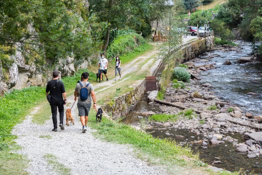 Ordino, Andorra: 26 August 2020: People enjoying the Valira del Orient river in Cami Ral in summer in Andorra.