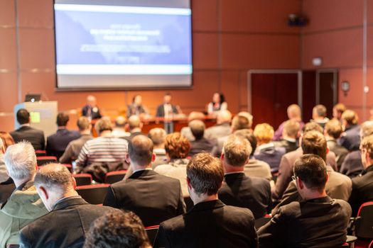 Round table discussion at business convention and presentation. Audience at the conference hall. Business and entrepreneurship symposium.