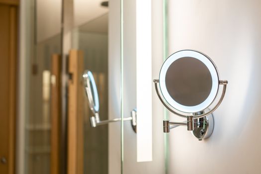 Ring light mirror with illumination in toilet.