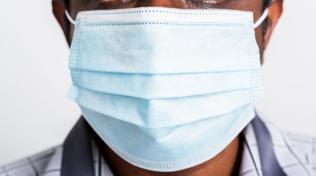 Asian happy portrait young black man wearing face mask protective from virus coronavirus epidemic or air pollution looking camera, studio shot isolated on white background, stop COVID-19 concept 