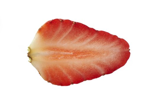 Overhead view of slice of strawberry on plain background