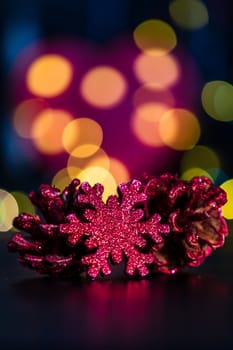 Decorations and ornaments in a colorful Christmas composition isolated on background of blurred lights.