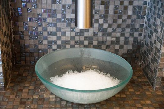 glass bowl with artificial snow in the spa complex.