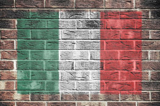 An Italy flag painted on brick wall background