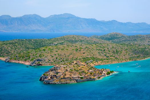 Island of Spinalonga with old fortress former leper colony and the bay of Elounda, Crete island, Greece
