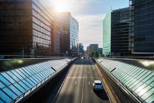 Street traffic in Brussels near European Commission building on sunset. Rue de la Loi , Bruxelles, Belgium