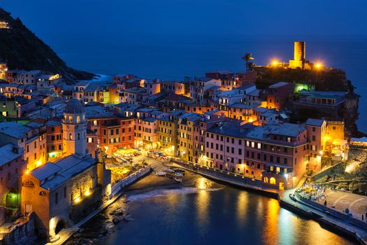 View of Vernazza village popular tourist destination in Cinque Terre National Park a UNESCO World Heritage Site, Liguria, Italy view illuminated in the night from Azure trail