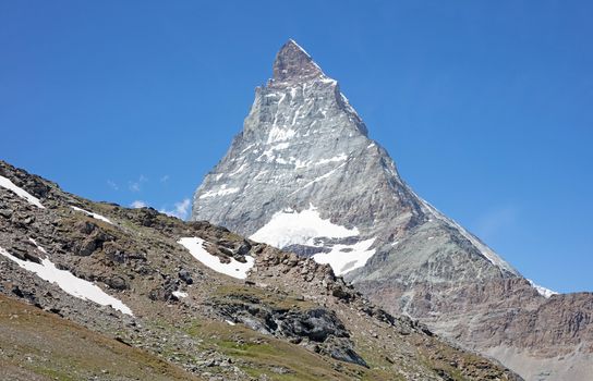 The Matterhorn, the iconic emblem of the Swiss Alps, summertime