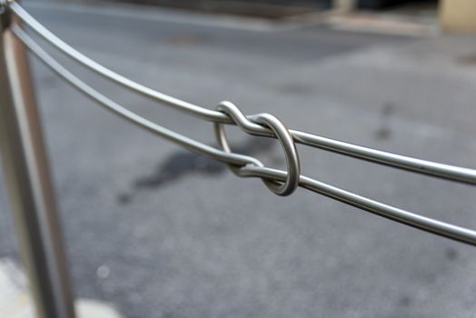 detail of a public iron railing for pedestrians