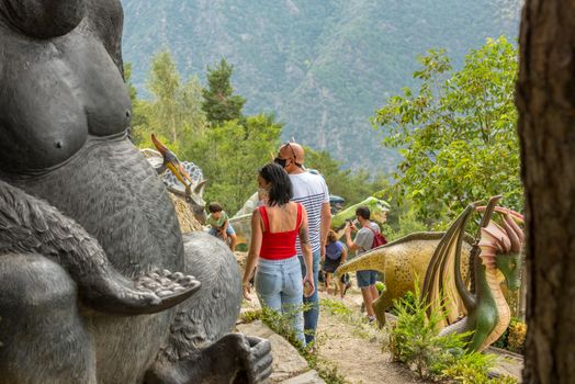 Juberri Sant Julia de Loria, Andorra: August 27 2020: Family enjoying of Sculptures in Jardins de Juberri in summer 2020 in the Pyrenees of Andorra.