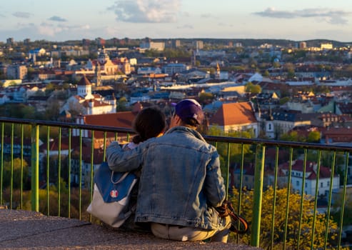 April 27, 2018 Vilnius, Lithuania. Lovers enjoy the view of the old city on the Three Crosses Hill in Vilnius.