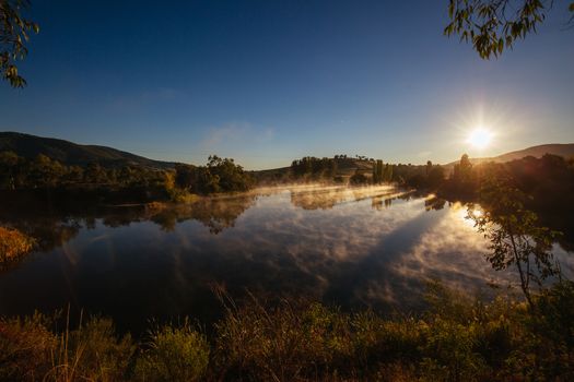 Classic Australian landscape and misty lake on a cold morning in Allans Flat, near Yackandandah in Victoria Australia