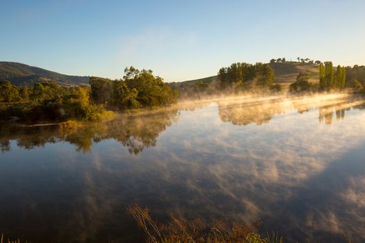 Classic Australian landscape and misty lake on a cold morning in Allans Flat, near Yackandandah in Victoria Australia