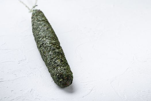 Fuet, salami wurst on white background with space for text.