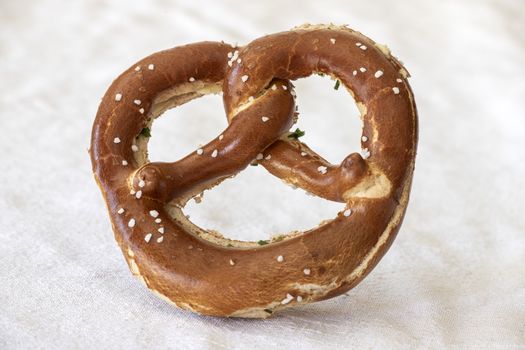 bavarian pretzel with butter on white