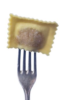 single raw ravioli on a fork